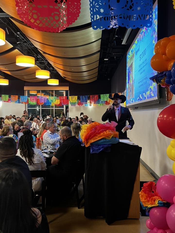 Fundraising auctioneer at live benefit auction