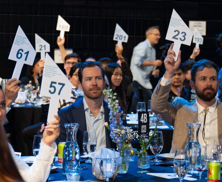 Paddles Up Fundraising Moment for Junior Achievement